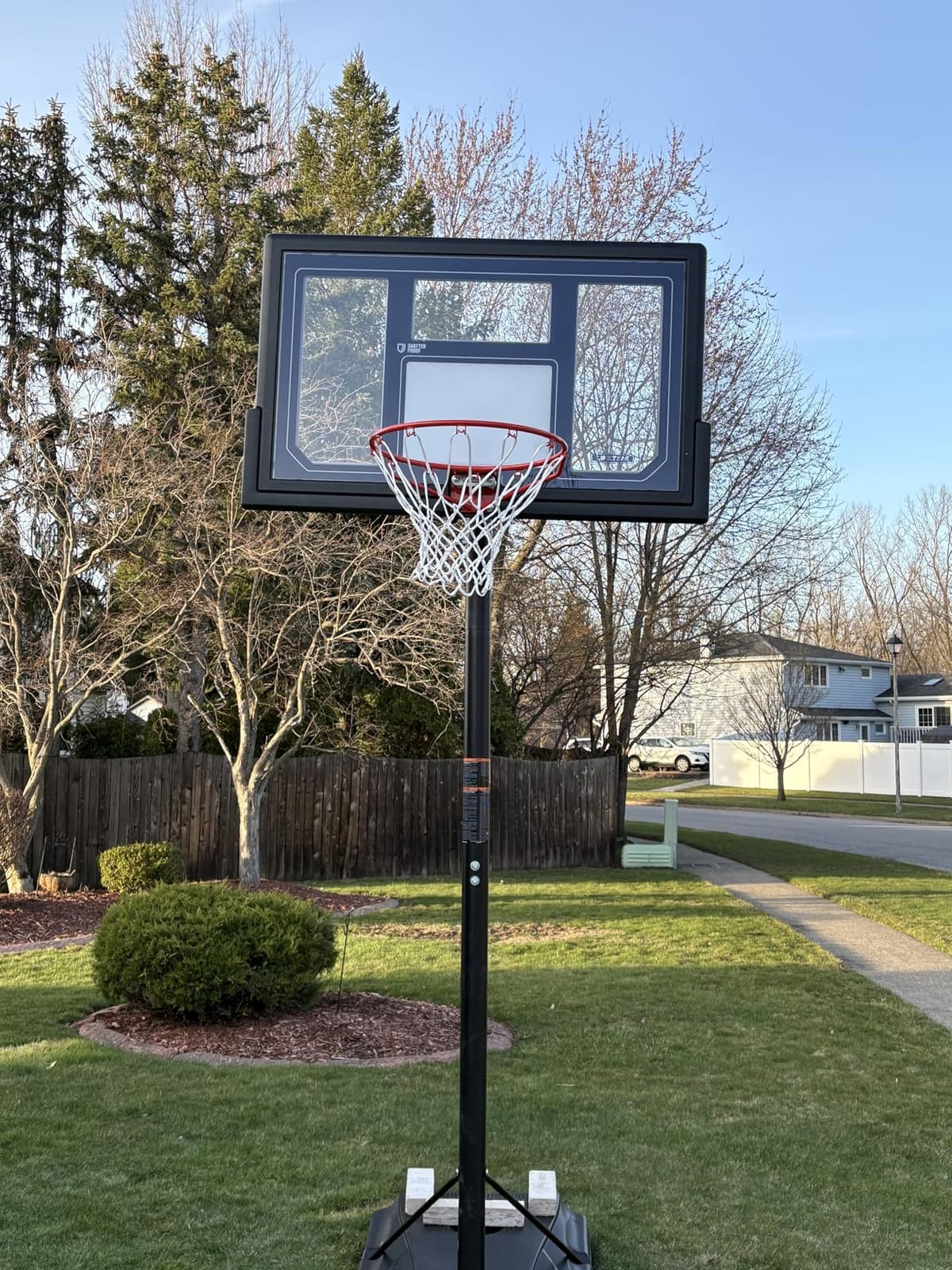 Lifetime 1529 Courtside Height Adjustable Portable Basketball System, 50 Inch Shatterproof Backboard, Black/Red/Blue, Standard customer photo 1