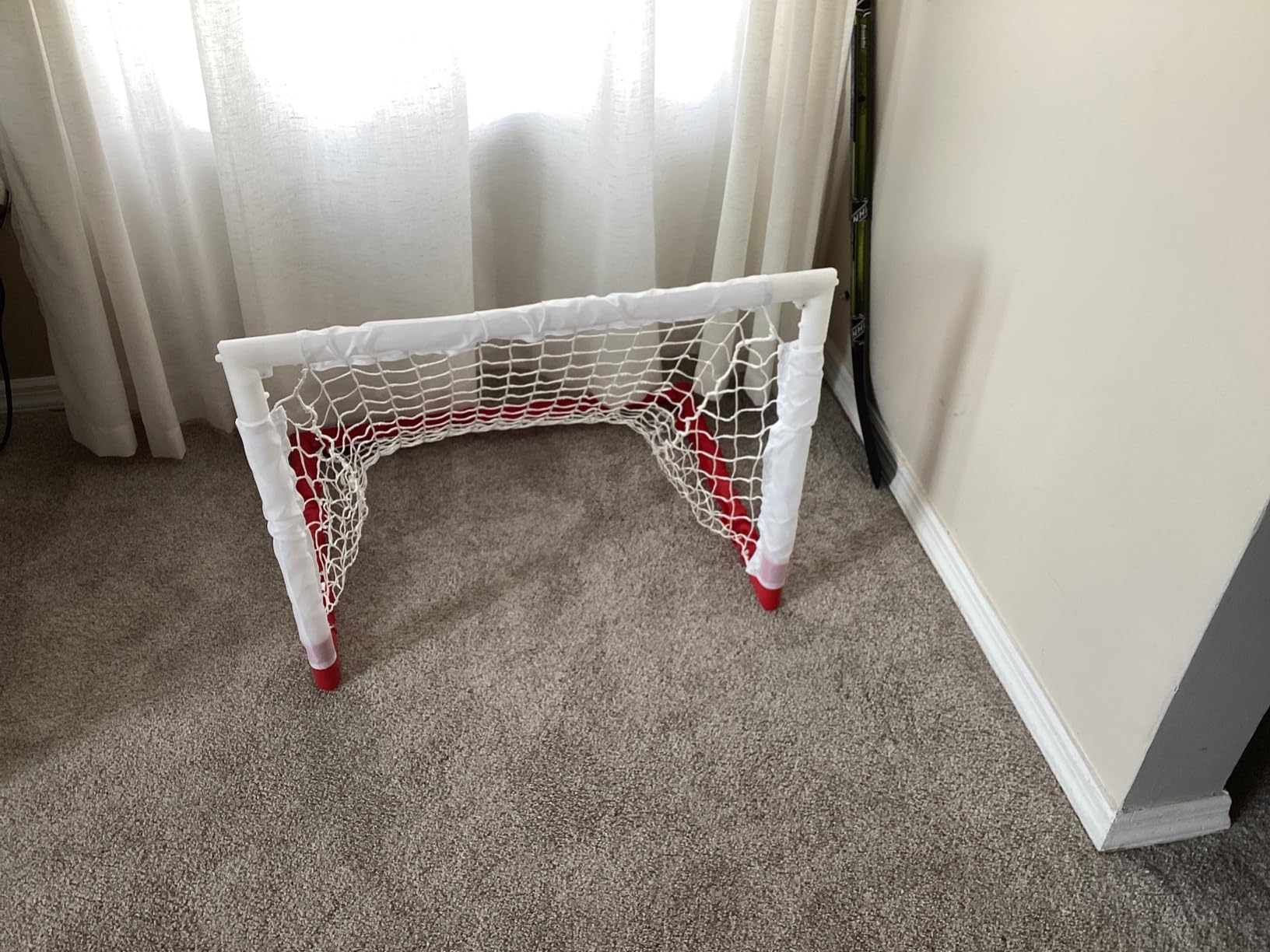 Franklin Sports - NHL Kids Folding Hockey Goals Set - (2) Street Hockey & Knee Hockey Goals - (2) Adjustable Youth Hockey Sticks, (2) Knee Hockey Sticks, (2) Mini Hockey Balls + (1) Street Hockey Ball customer photo 1