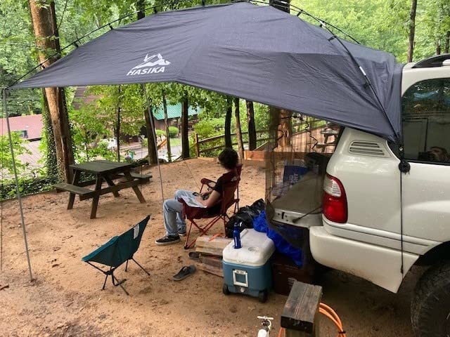 Hasika Waterproof SUV Tailgate Tent and Car Awning | Universal fit for SUVs Vans RV Trailer. Features heavy-duty suction cups, adjustable poles, and 76 sq ft of waterproof shade customer photo 1