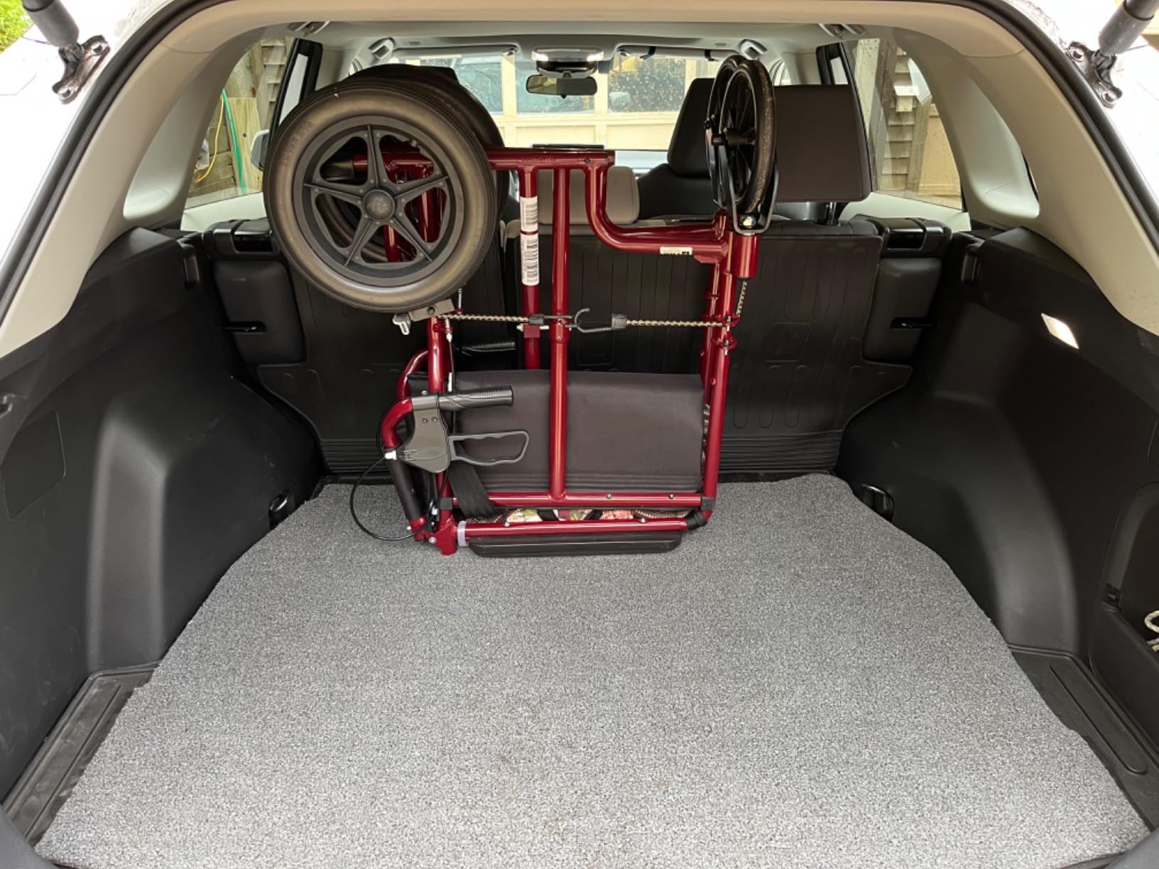 Medline Lightweight Foldable Transport Wheelchair with Handbrakes and 12-Inch Wheels, Red Frame, Black Upholstery customer photo 1