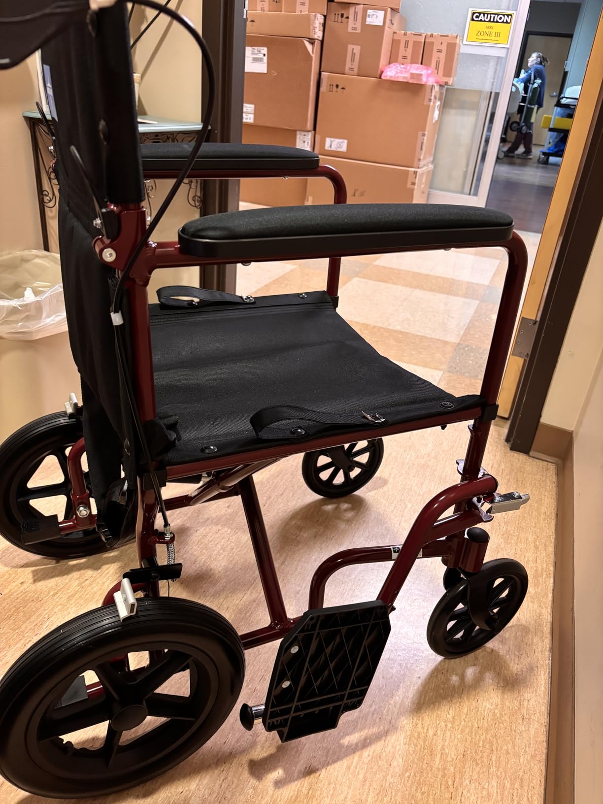 Medline Lightweight Foldable Transport Wheelchair with Handbrakes and 12-Inch Wheels, Red Frame, Black Upholstery customer photo 2