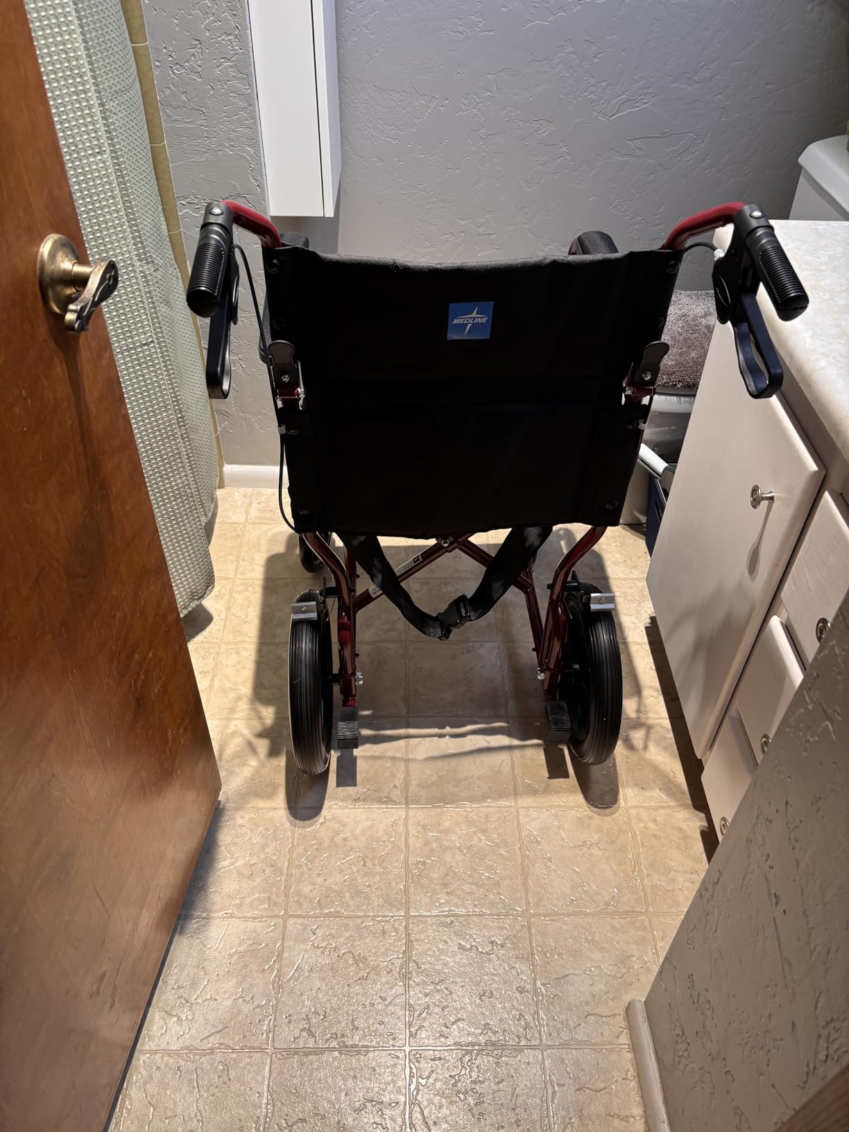 Medline Lightweight Foldable Transport Wheelchair with Handbrakes and 12-Inch Wheels, Blue Frame, Black Upholstery customer photo 2
